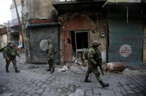 Russian soldiers walk in the Old City of Aleppo, Syria January 31, 2017. REUTERS/Ali Hashisho