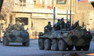 Russian soldiers, on armored vehicles, patrol a street in Aleppo, Syria February 2, 2017. REUTERS/Ali Hashisho